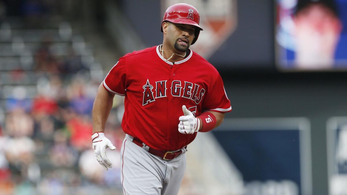 Angels veteran Albert Pujols rounds third base after hitting a solo home run against the Minnesota Twins in June.
