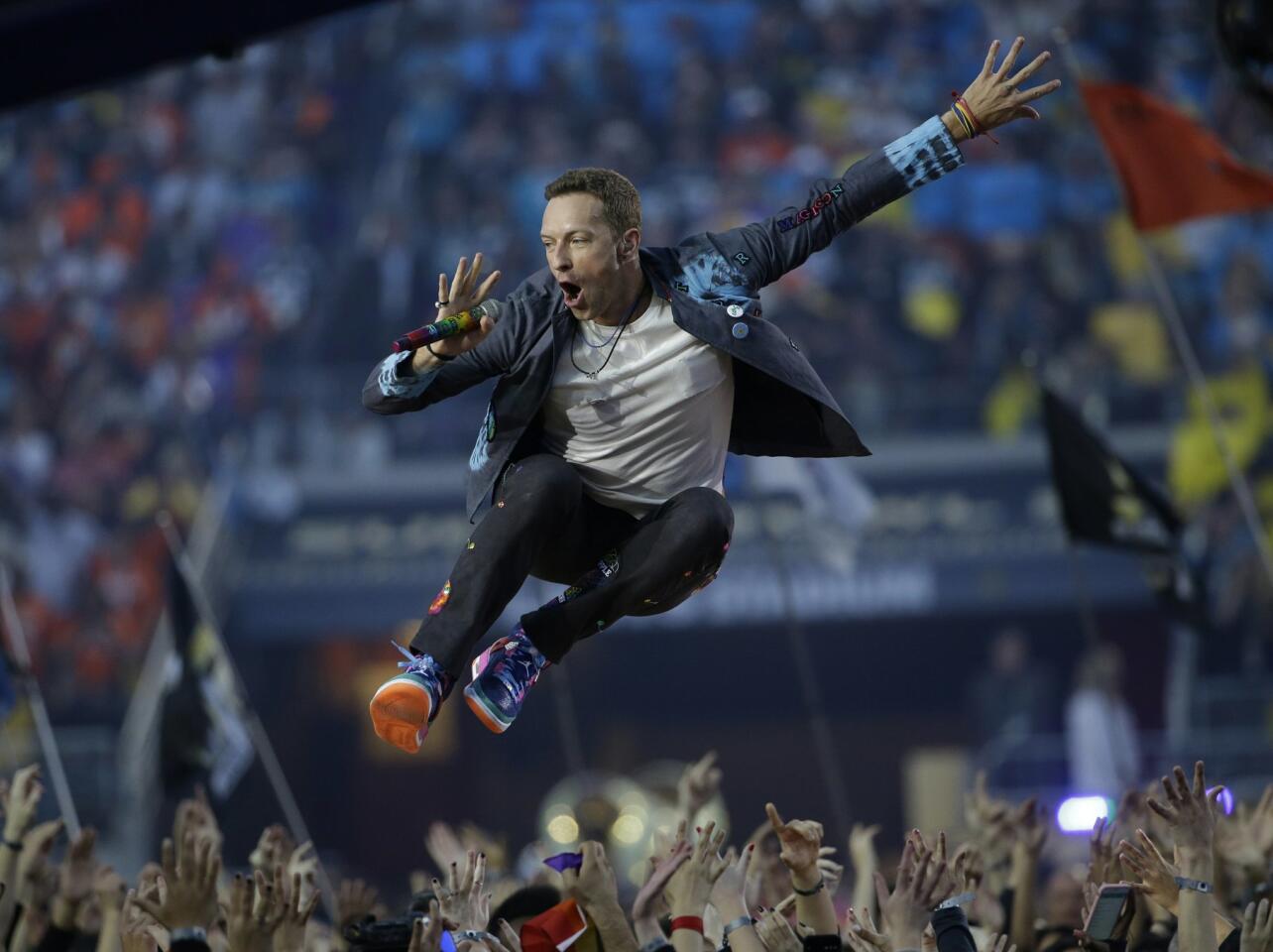 Cold Play lead singer Chris Martin performs during halftime of the NFL Super Bowl 50. AP Photo/Marcio Jose Sanchez