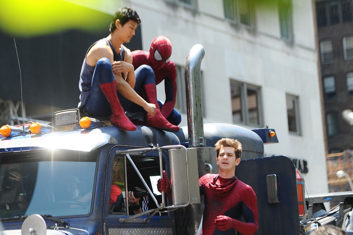 Actor Andrew Garfield, right, his stunt double William Spencer, center, and a second stunt double are seen on the set of "The Amazing Spider-Man 2" in New York City.