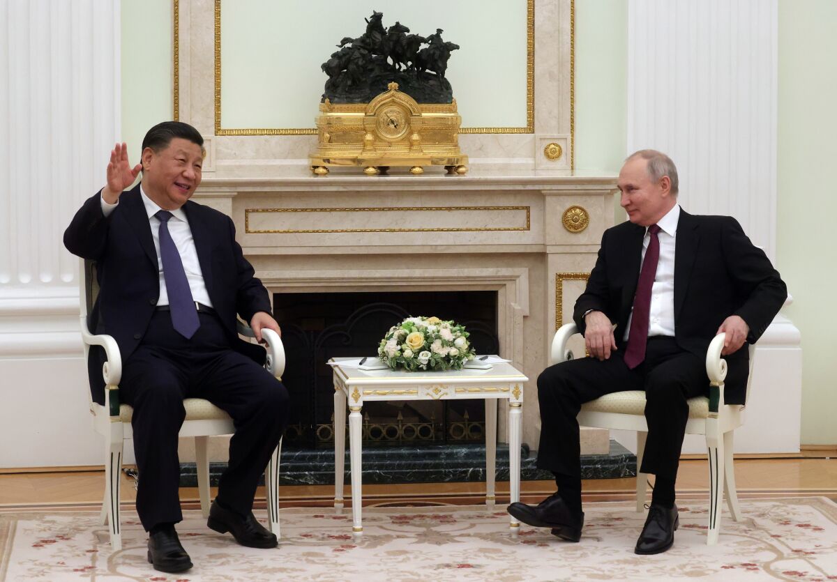 Chinese President Xi Jinping, left, gestures while speaking to Russian President Vladimir Putin during their meeting at the Kremlin in Moscow, Russia, March 20, 2023. President Putin gushed about China's economic success as he welcomed Chinese leader Xi to the Kremlin this week. China isn't just Moscow's diplomatic partner in opposing what they see as U.S. domination of global affairs. (Sergei Karpukhin, Sputnik, Kremlin Pool Photo via AP, File)