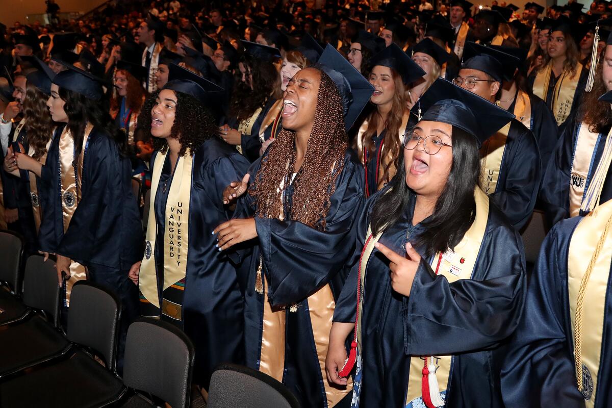 From right, Venus Calangian, 22, Asia Collins, 21, and Caira Lee-Gray, 25, sing at Vanguard's undergraduate commencement.