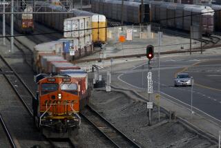 LONG BEACH, CALIF. -MAR. 14, 2020. A diesel locomotive hauls cargo from the Port of Long Beach on Saturday, Mar. 14, 2020. Shipping executives say that the global coronavirus pandemic may cause a 20 percent drop in goods arriving in west coast ports like Los Angeles and Long Beach. (Luis Sinco/Los Angeles Times)