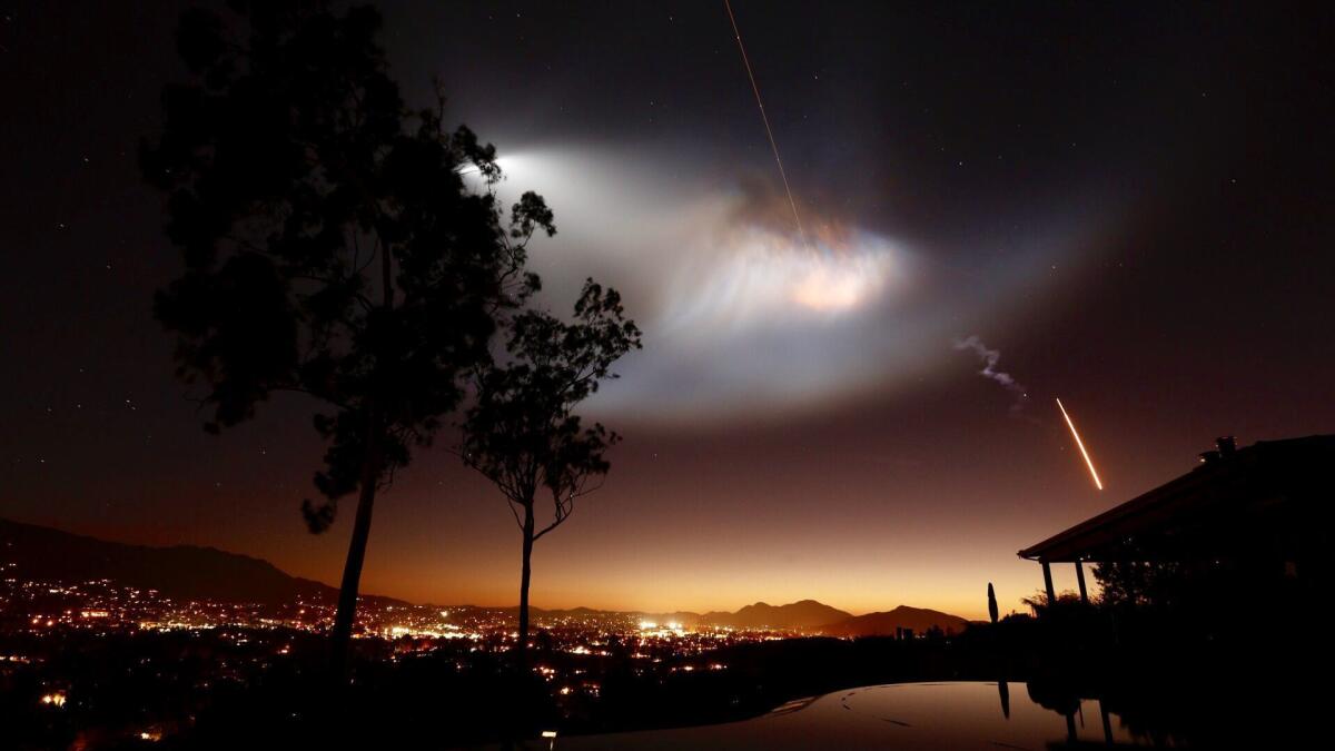 The Space X Falcon 9 rocket launch from Vandenberg Air Force Base lights up the sky as seen from Thousand Oaks CA.