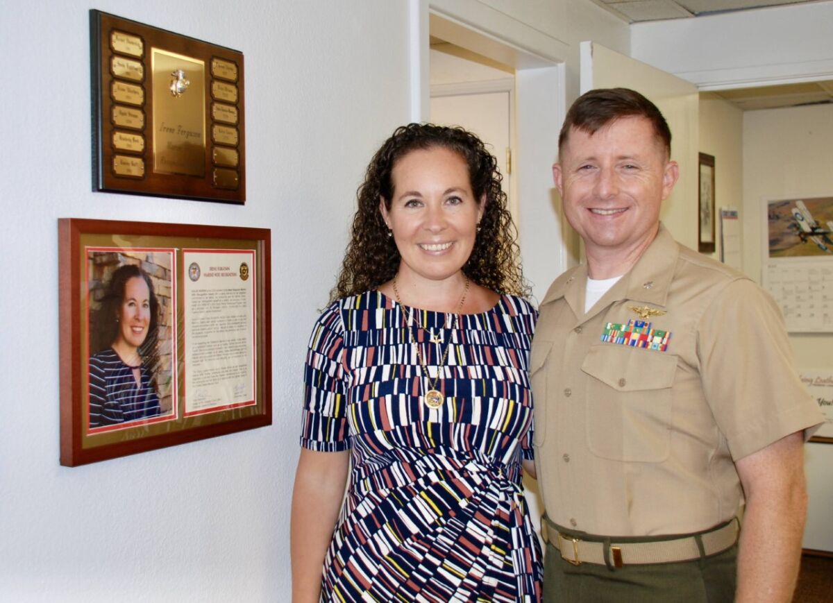 Kailee Norris, left, winner of the Irene Ferguson Marine Wife Recognition Award