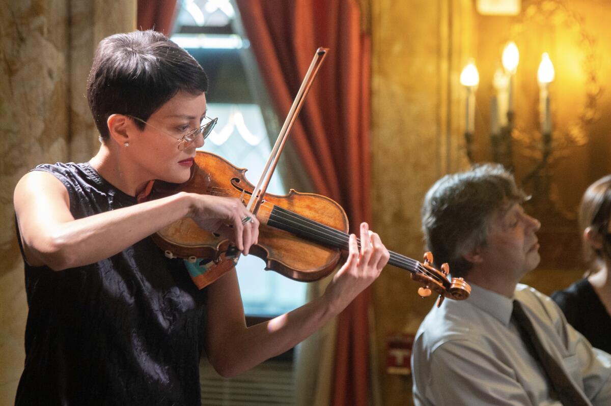 A woman playing violin