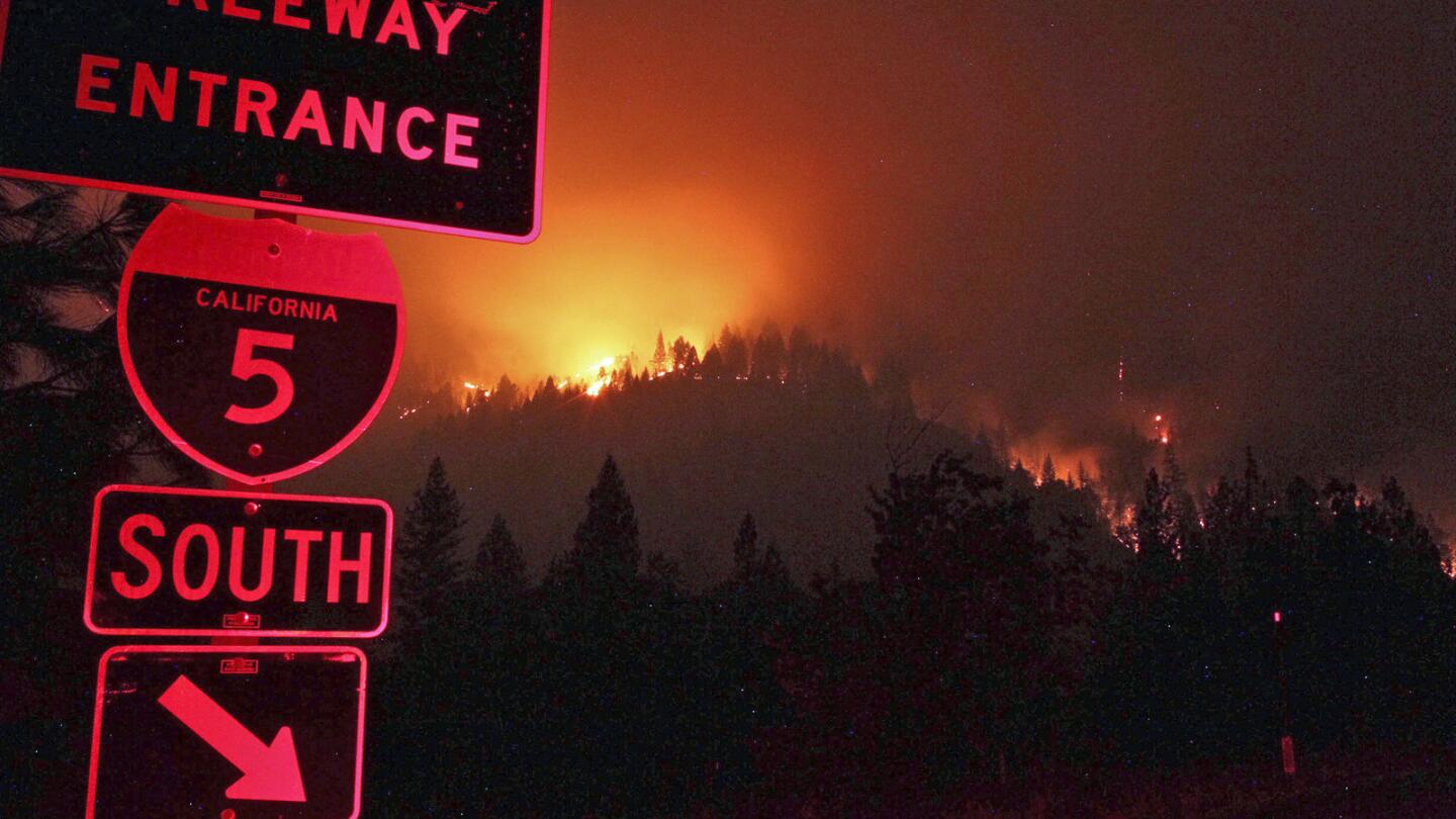 Wildfires burn Friday on the ridgeline east of I-5 just south of the Gibson Road exit near Shasta-Trinity National Forest.