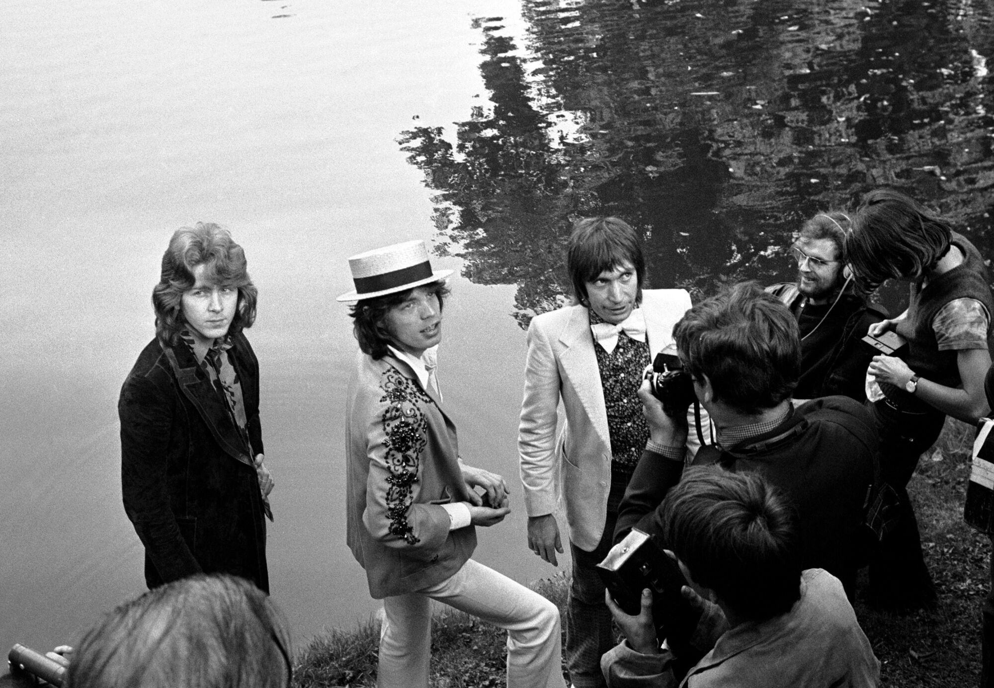 Mick Taylor, Mick Jagger and Charlie Watts hold a press conference at the Bois de Boulogne in Paris in 1972.
