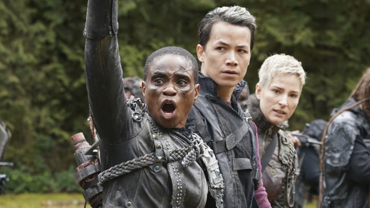 Adina Porter, left, Shannon Kook and Shelby Flannery in "The 100."
