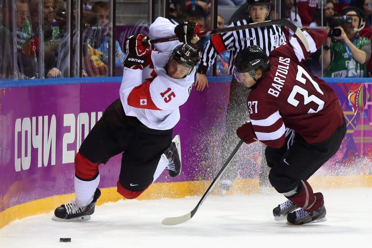 Ryan Getzlaf, left, and the Canadian team defeated Latvia, 2-1, to advance to the semifinals to face the United States.