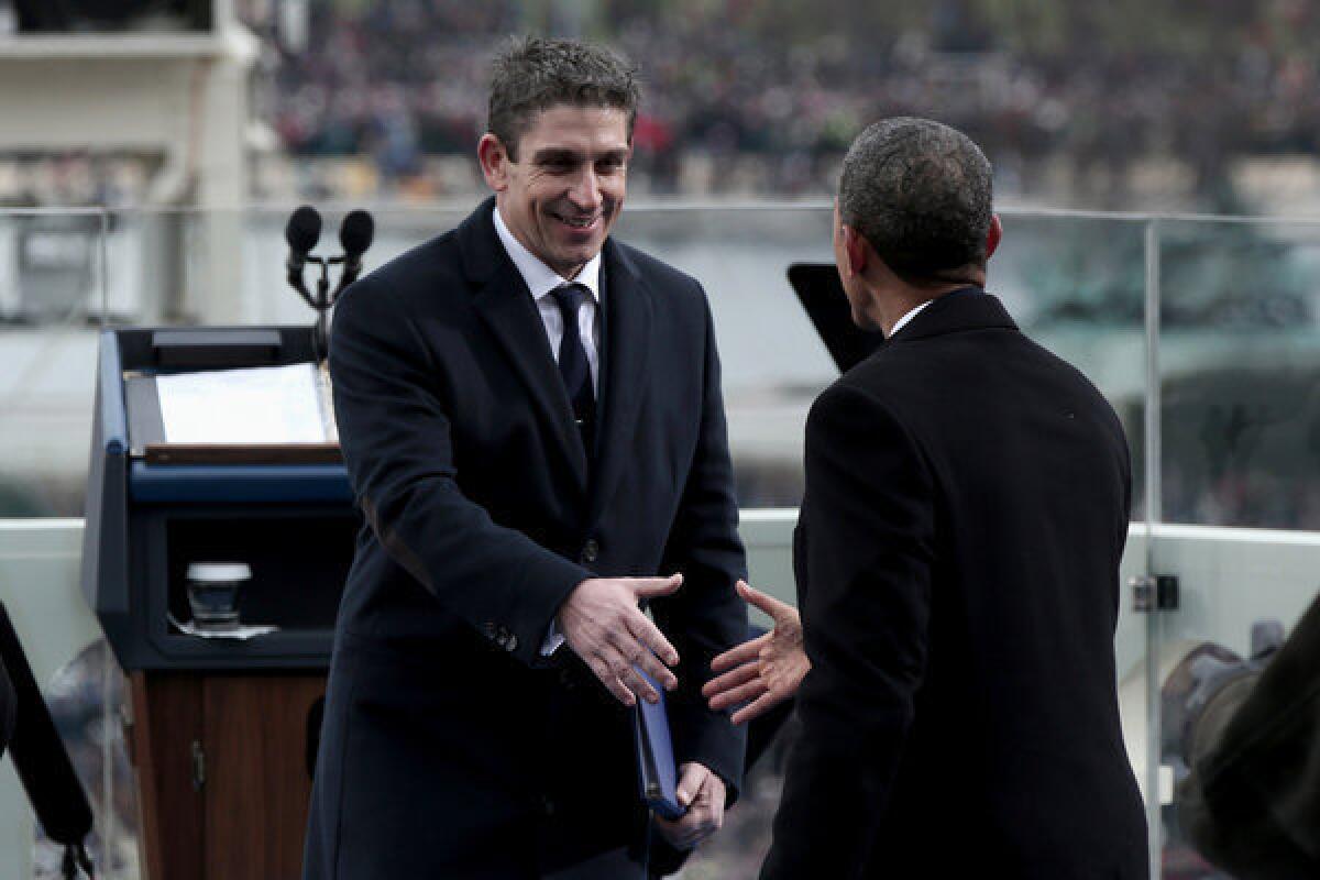 Richard Blanco is greeted by President Obama during the 57th presidential inauguration.