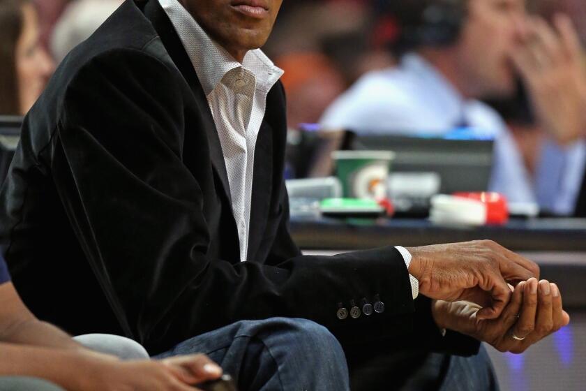 Former player Scottie Pippen of the Chicago Bulls takes in a game between the Bulls and the Los Angeles Clippers at the United Center on January 24, 2014.