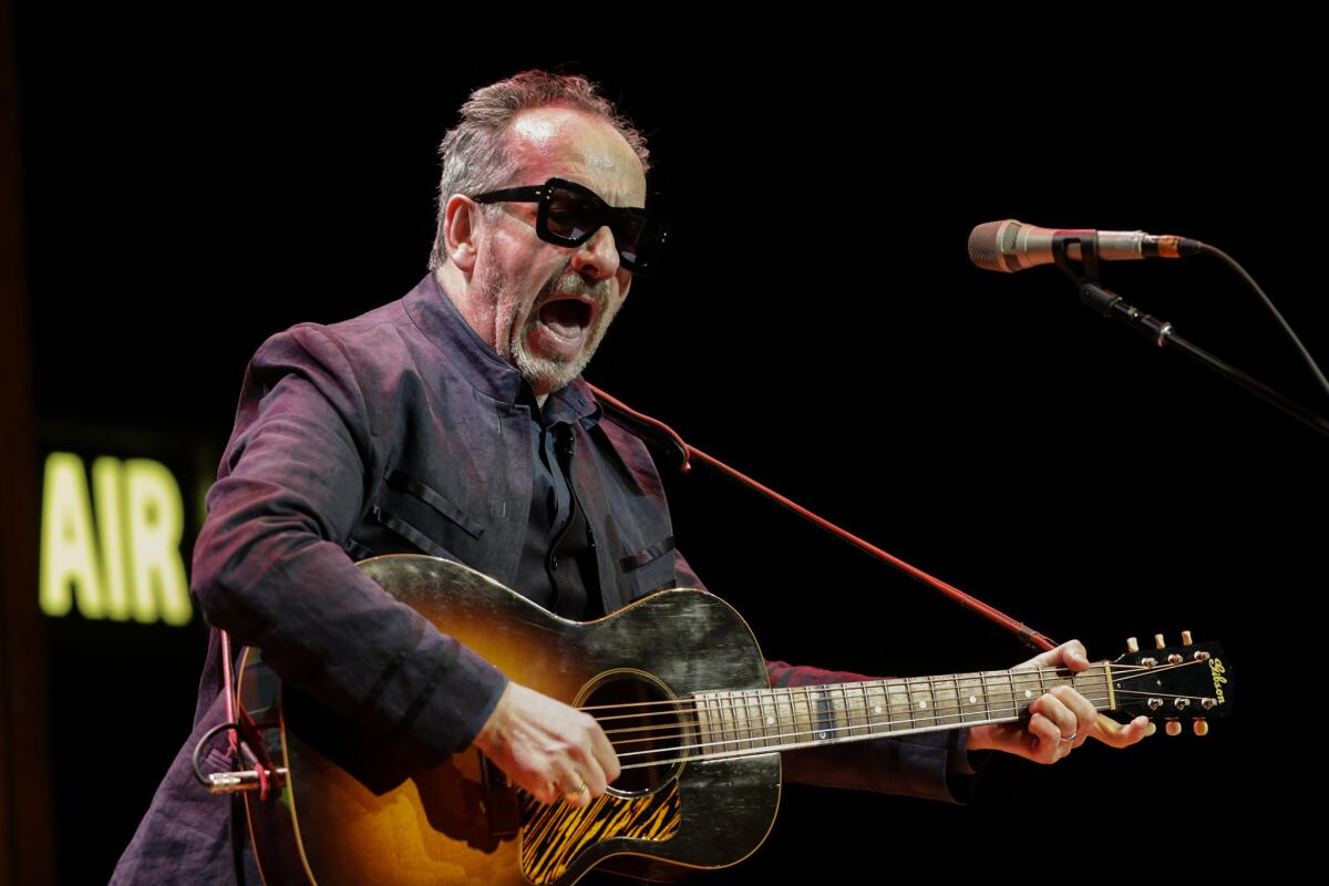 Elvis Costello performs Saturday for the first of two sold-out shows at the Theater at ACE Hotel. He offered the audience anecdotes from his life both disarmingly revealing and often uproariously funny.