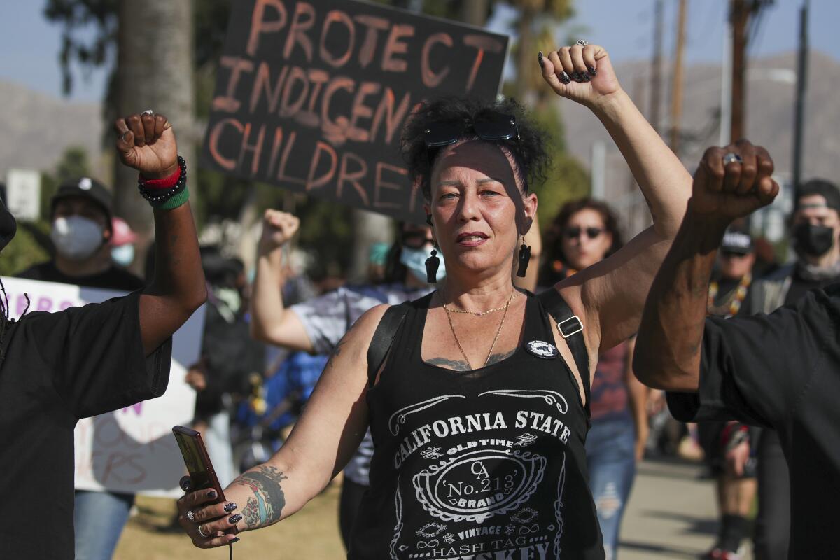  Community members protest outside John W. North High School in Riverside. 