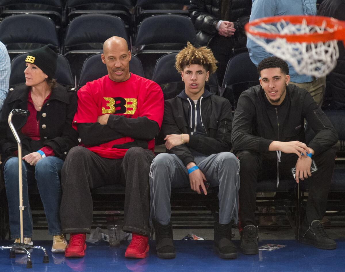 LaVar Ball takes in a Lakers-Knicks game at Madison Square Garden with his wife Tina and sons LaMelo (second from right) and LiAngelo.