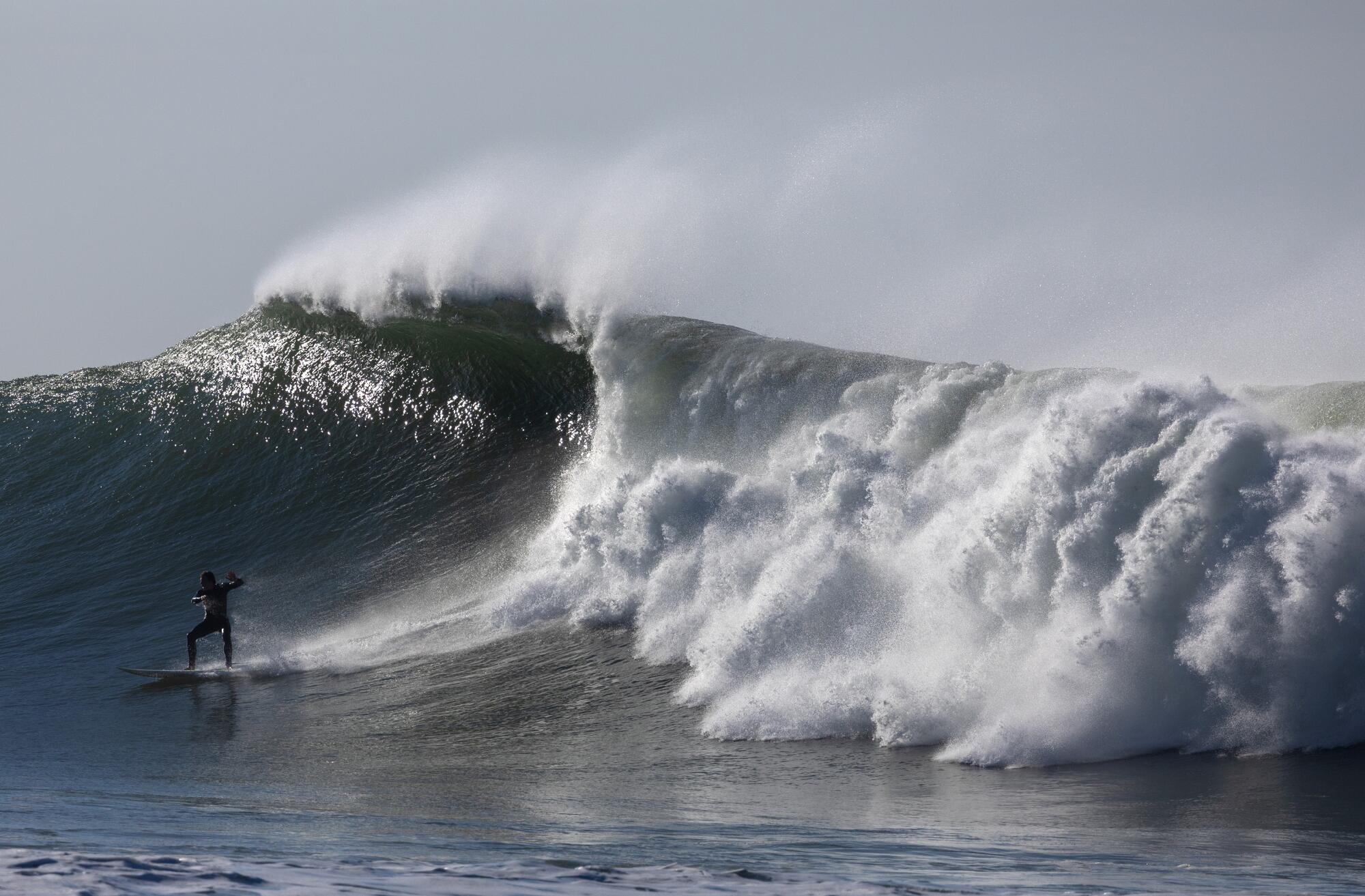 A surfer rides a wave at Surfer's Point on Thursday in Ventura.