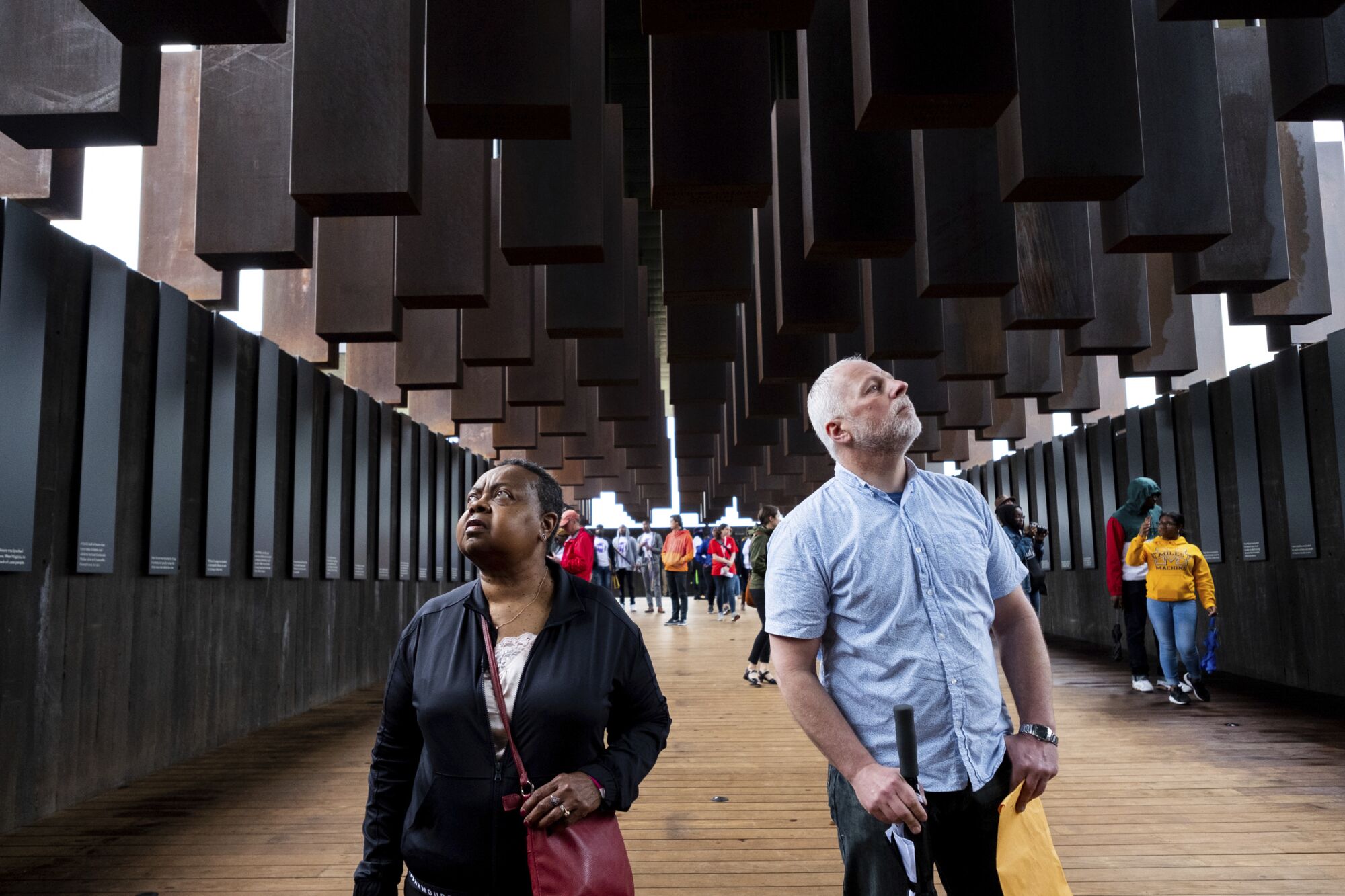 Virginia Huston and Warren Read gaze up inside the National Memorial for Peace and Justice in Montgomery, Ala., in 2018.