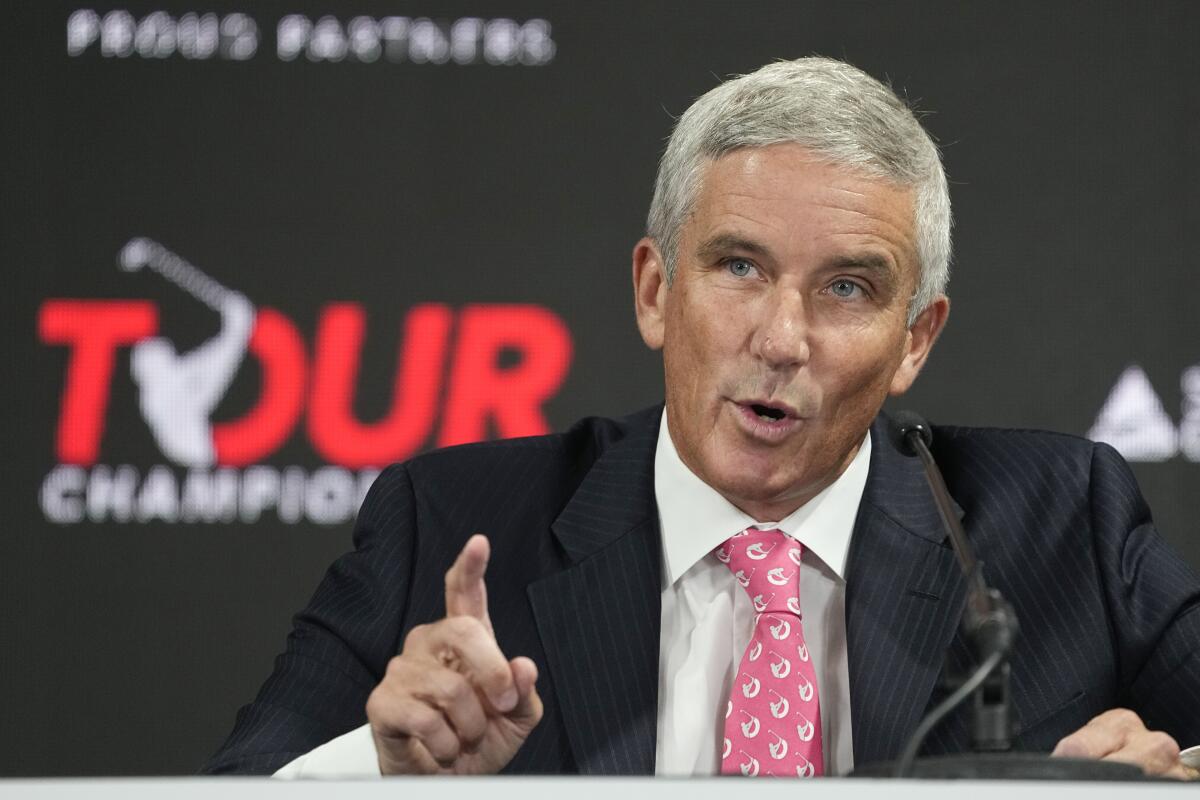 PGA Tour Commissioner Jay Monahan points during a news conference