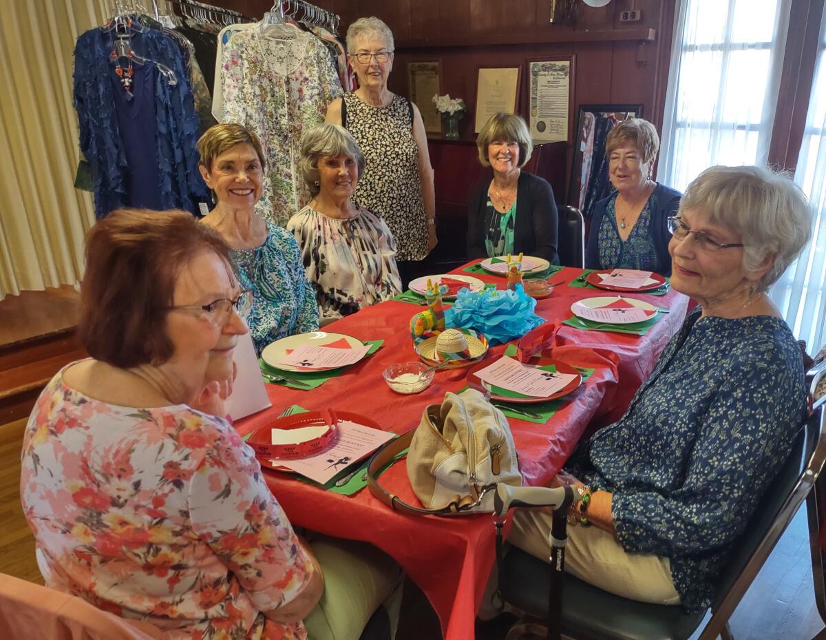 Guests of the Ramona Womans Club Fashion Show gather for a Mexican-themed lunch prepared by Ramona High School students.