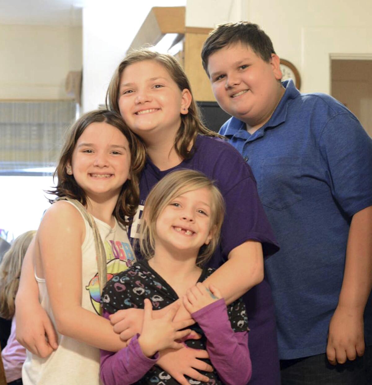 From left, Megan Hill, Emily Hill, Greg Hill and survivor Evelyn Hill, bottom, in Floresville, Texas.