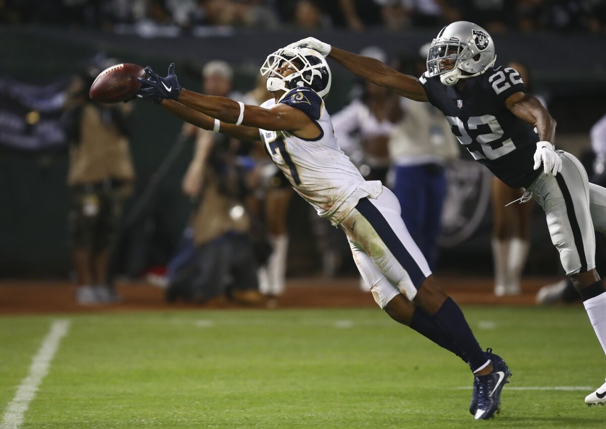 Los Angeles Rams wide receiver Robert Woods misses the ball as Oakland Raiders defensive back Rashaan Melvin defends during the second half.