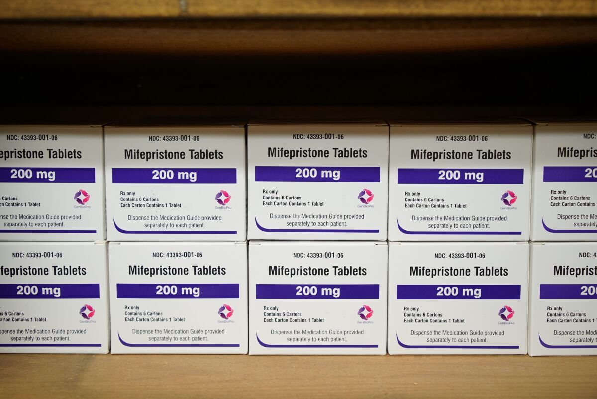 FILE - Boxes of the drug mifepristone line a shelf at the West Alabama Women's Center in Tuscaloosa, Ala., on Wednesday, March 16, 2022. The drug is one of two used together in "medication abortions." On Friday, June 17, The Associated Press reported on stories circulating online incorrectly claiming medication abortions are dangerous. (AP Photo/Allen G. Breed, File)
