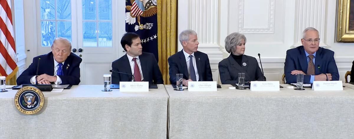 Trump administration officials and ExxonMobil Chair Darren Woods 