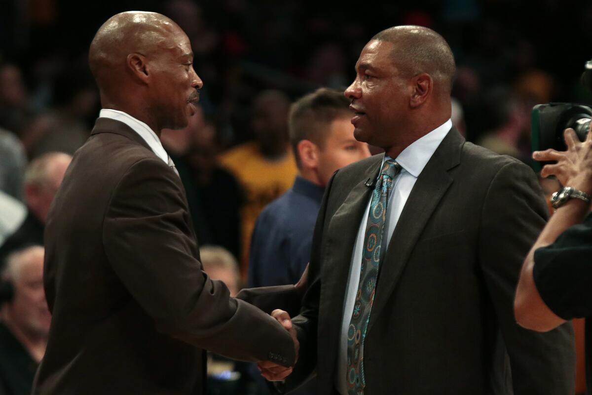 Lakers Coach Byron Scott and Clippers Coach Doc Rivers greet each other before their teams' first meeting at Staples Center on Oct. 31. The Clippers beat the Lakers, 118-111.