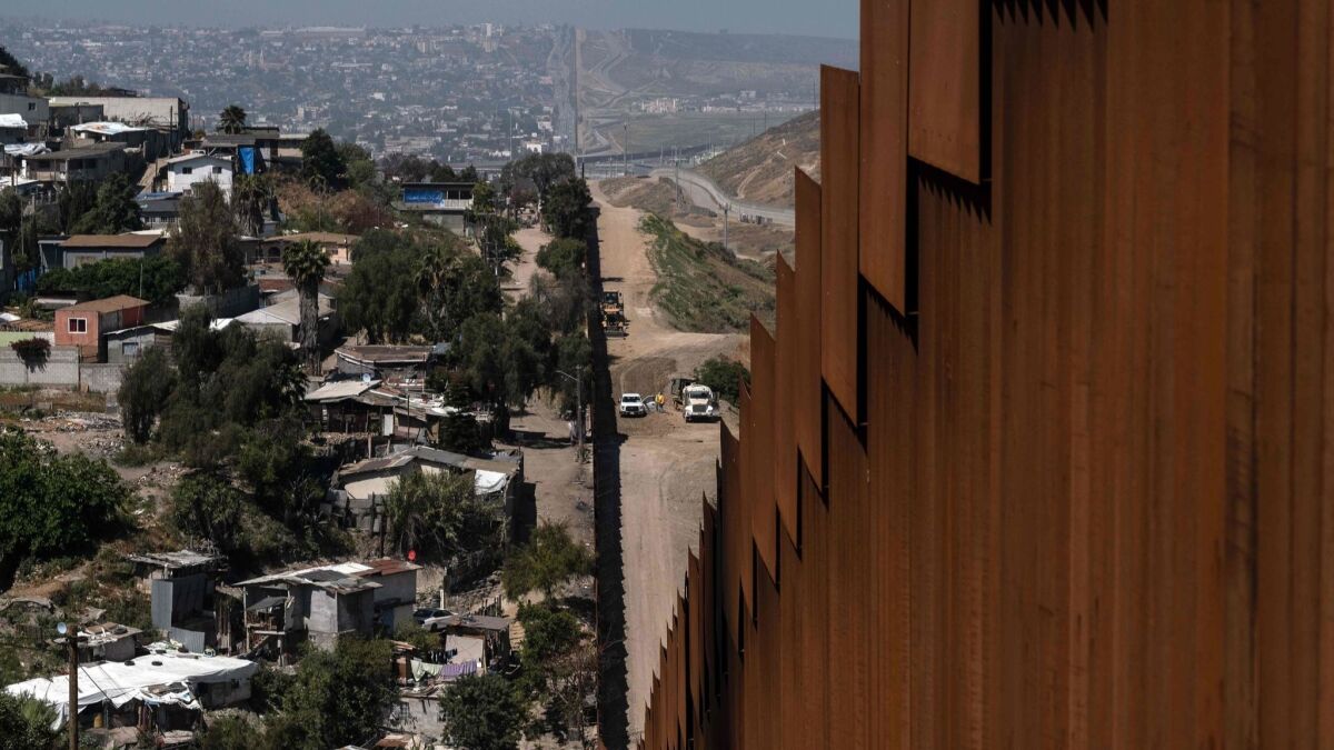 A fence on the U.S.-Mexico border separates Tijuana, left, and California.