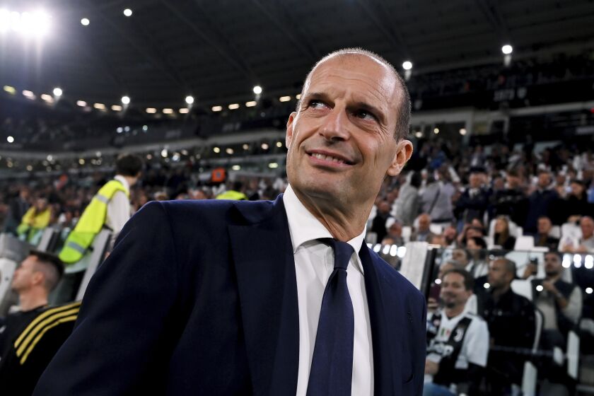 Juventus coach Massimiliano Allegri enters the pitch prior to the Serie A soccer match between Juventus and Bologna, at the Juventus stadium in Turin, Italy, Sunday, Oct. 2, 2022. (Marco Alpozzi/LaPresse via AP)