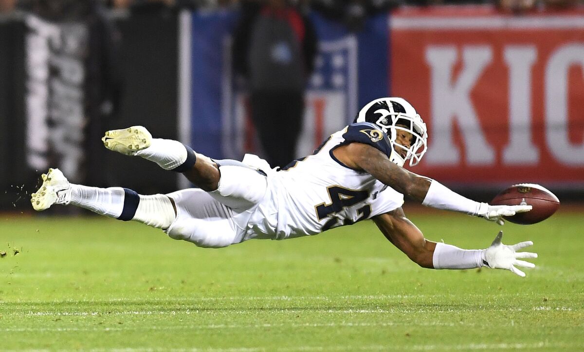 Los Angeles Rams safety John Johnson dives but comes up short of intercepting the ball against the Raiders Monday night.