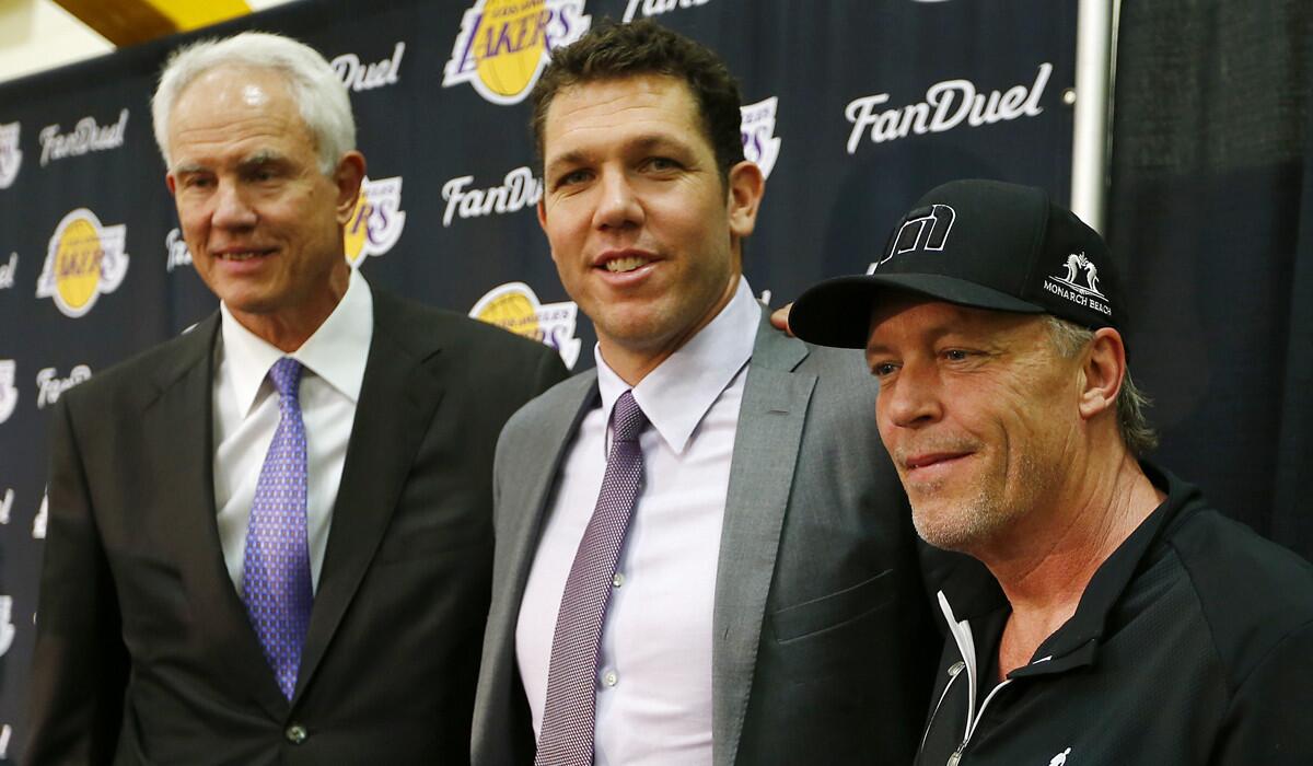 New Lakers Coach Luke Walton, center, with General Manager Mitch Kupchak, left, and team owner Jim Buss during his introductory news conference in El Segundo on June 21.