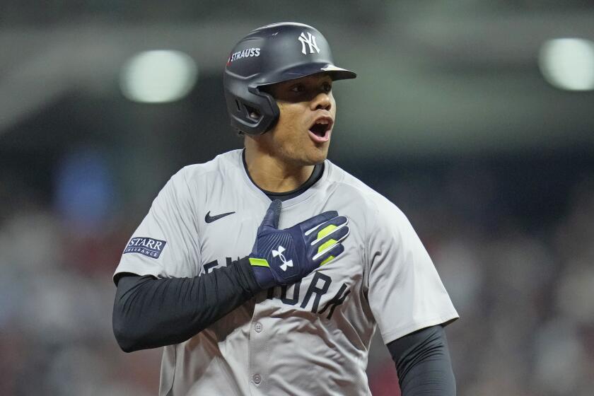 New York Yankees' Juan Soto celebrates after hitting a three-run home run agains.