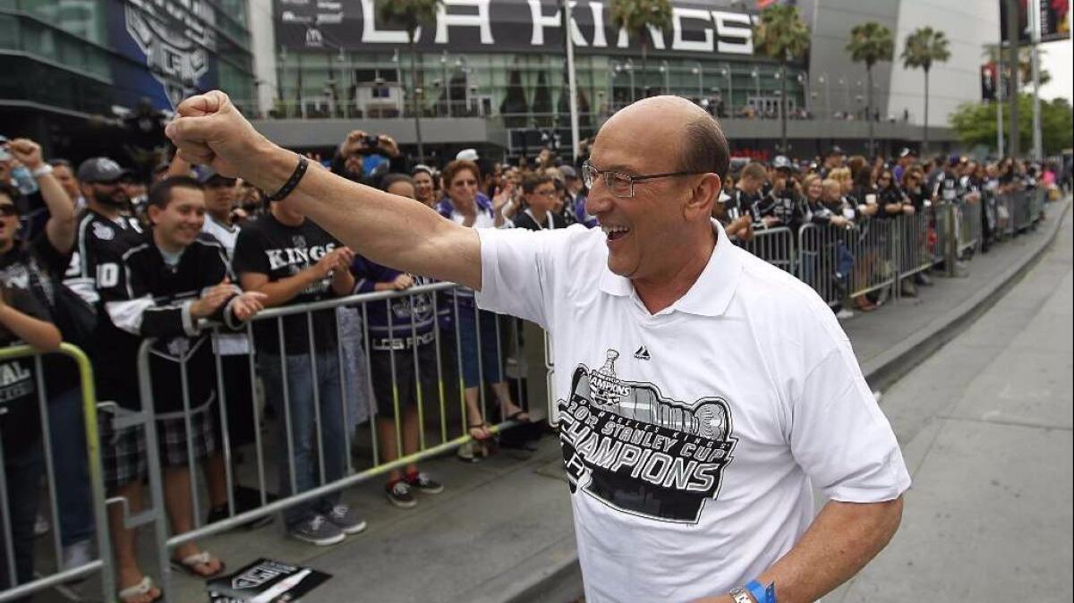 Kings broadcaster Bob Miller is cheered by fans as they turn out to celebrate the Kings' 2012 Stanley Cup championship.
