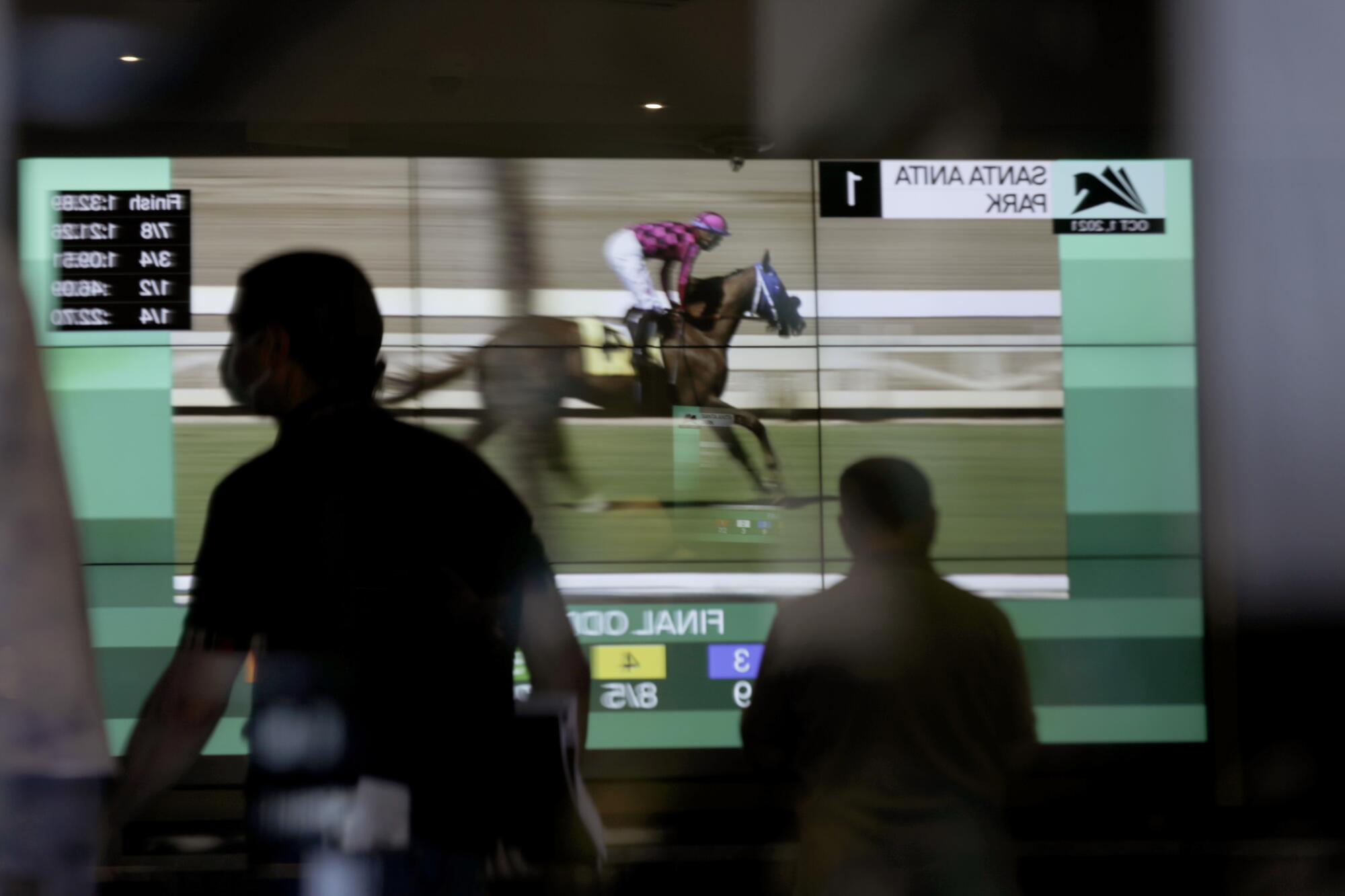 Jockey Juan Hernandez rides Carmelita's Man to victory.