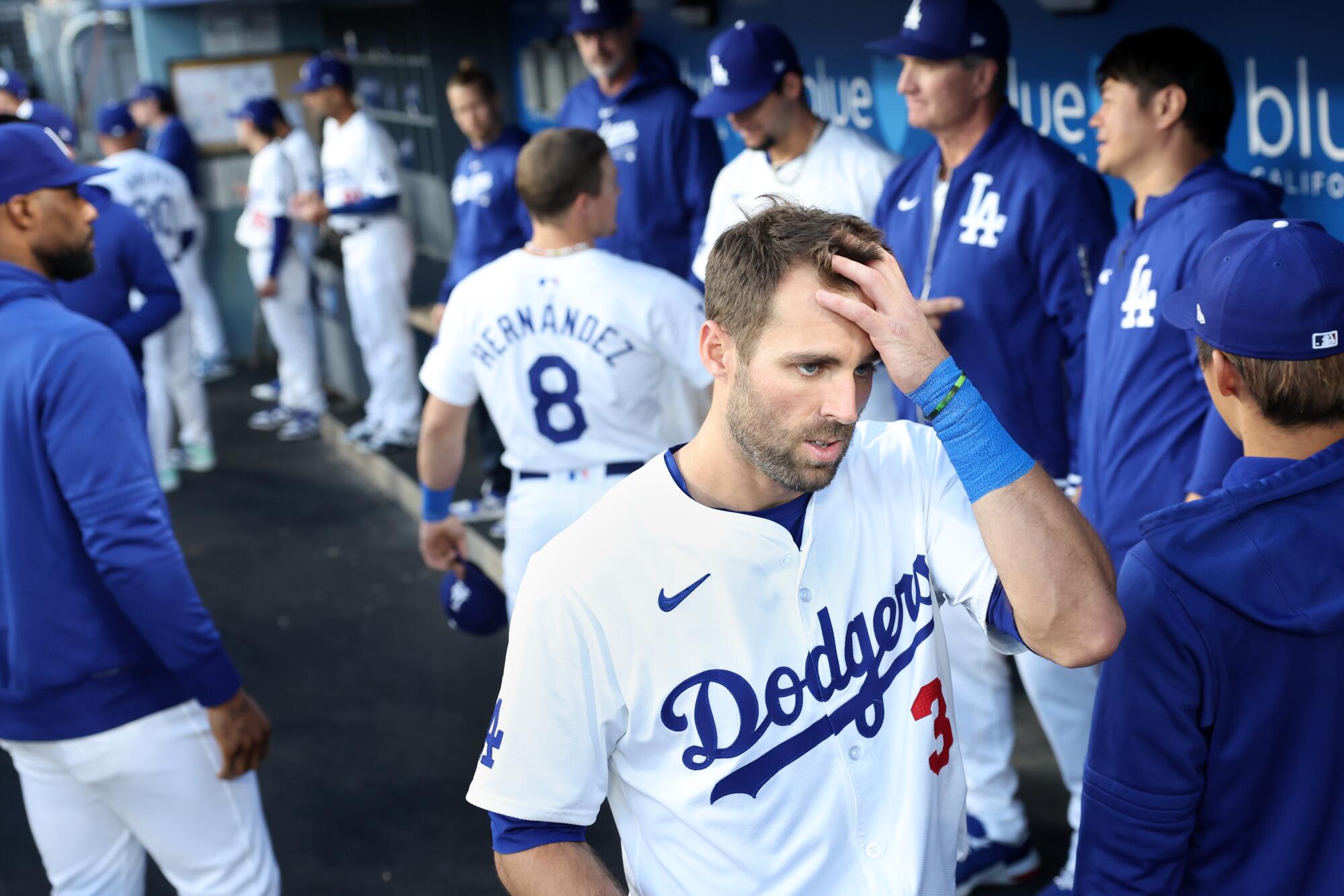 Chris Taylor puts his hand on his head in the dugout during a game against the Nationals at Dodger Stadium.