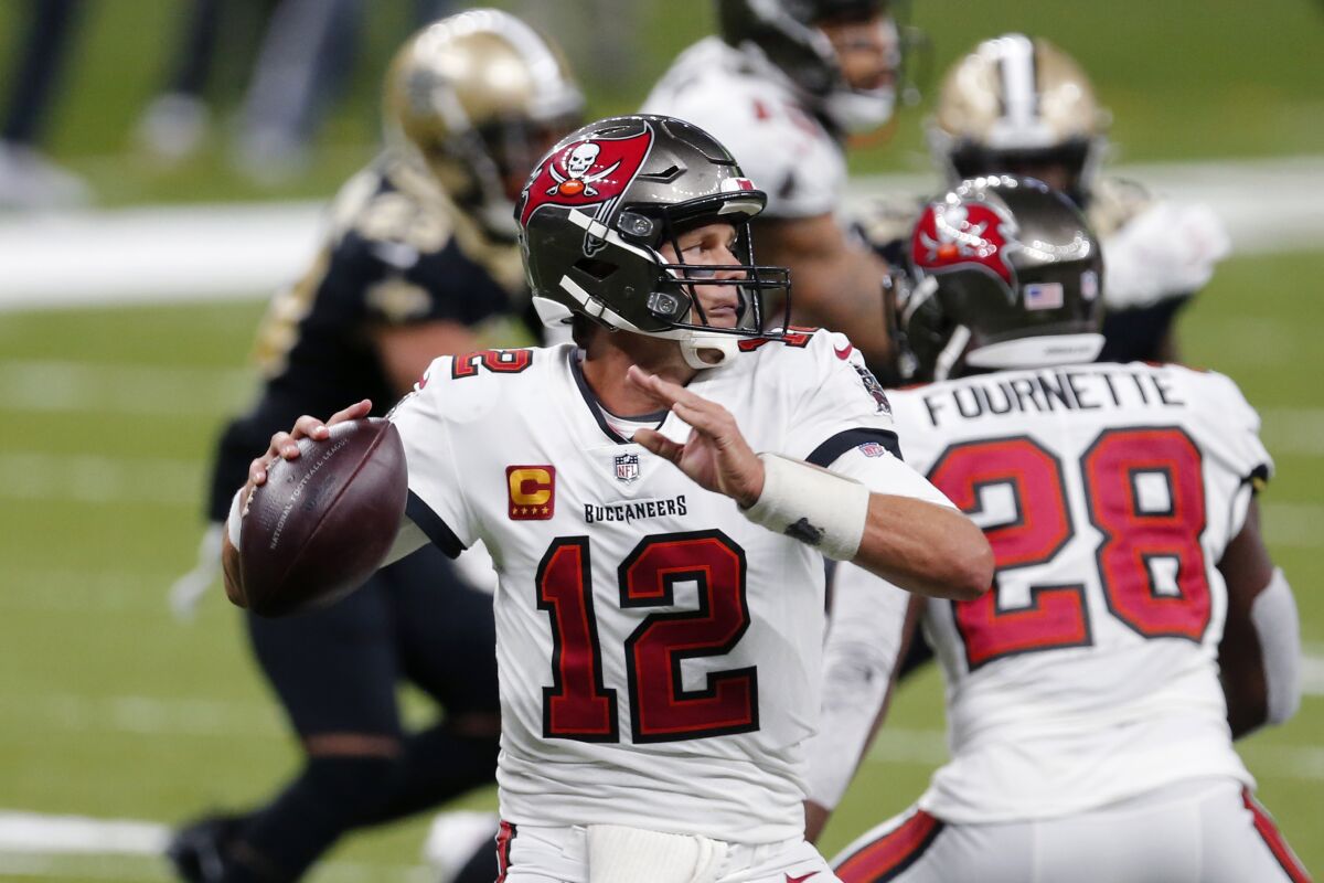 Tampa Bay Buccaneers quarterback Tom Brady (12) passes in the second half of an NFL football game against the New Orleans Saints in New Orleans, Sunday, Sept. 13, 2020. (AP Photo/Brett Duke)