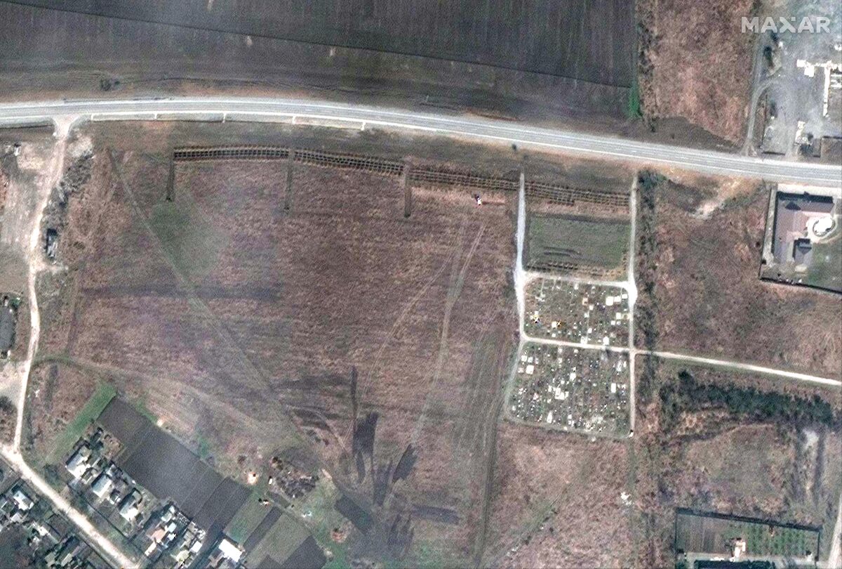 This satellite image shows an overview of the cemetery in Manhush, some 20 kilometers west of Mariupol, Ukraine. 