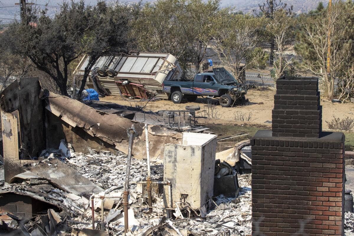 The Bobcat fire has burned through the Angeles National Forest and destroyed this home in Juniper Hills.