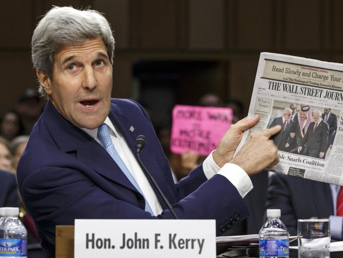 Secretary of State John F. Kerry, appearing before the Senate Foreign Relations Committee on Wednesday, points to a newspaper photo of the recent Arab summit in Saudi Arabia as an example of the kind of coalition he expected in combating Islamic State extremists in Iraq and Syria.