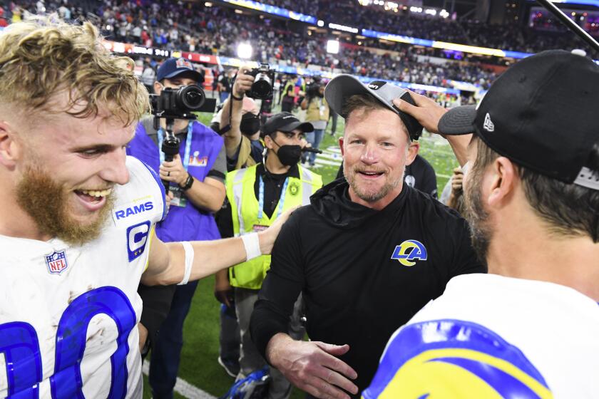 Inglewood, CA - February 13: Los Angeles Rams wide receiver Cooper Kupp (from left) celebrates with general manager Les Snead and quarterback Matthew Stafford (9) after defeating the Cincinnati Bengals 23-20 in Super Bowl LVI at SoFi Stadium on Monday, Feb. 13, 2022 in Inglewood, CA.(Wally Skalij / Los Angeles Times)