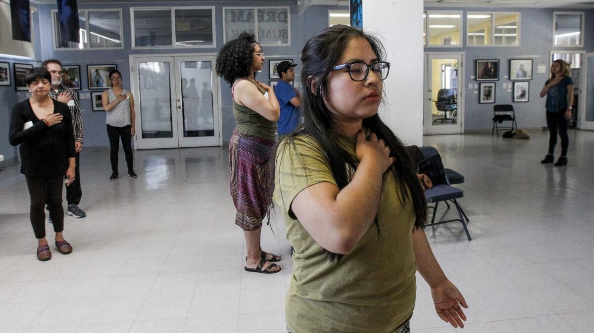 Community members and activist go through some exercise and relaxing session held UCLA Labor Center so they not to burn out and relax and stay focused.