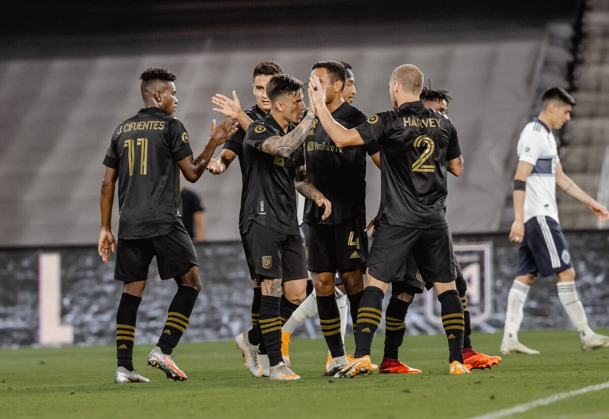 LAFC players celebrate during a game against the Vancouver Whitecaps.