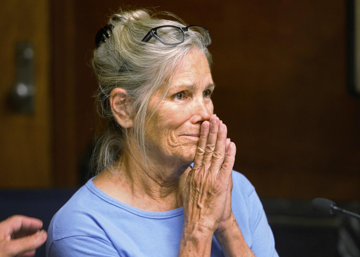 Leslie Van Houten reacts after hearing she is eligible for parole during a hearing at the California Institution for Women.