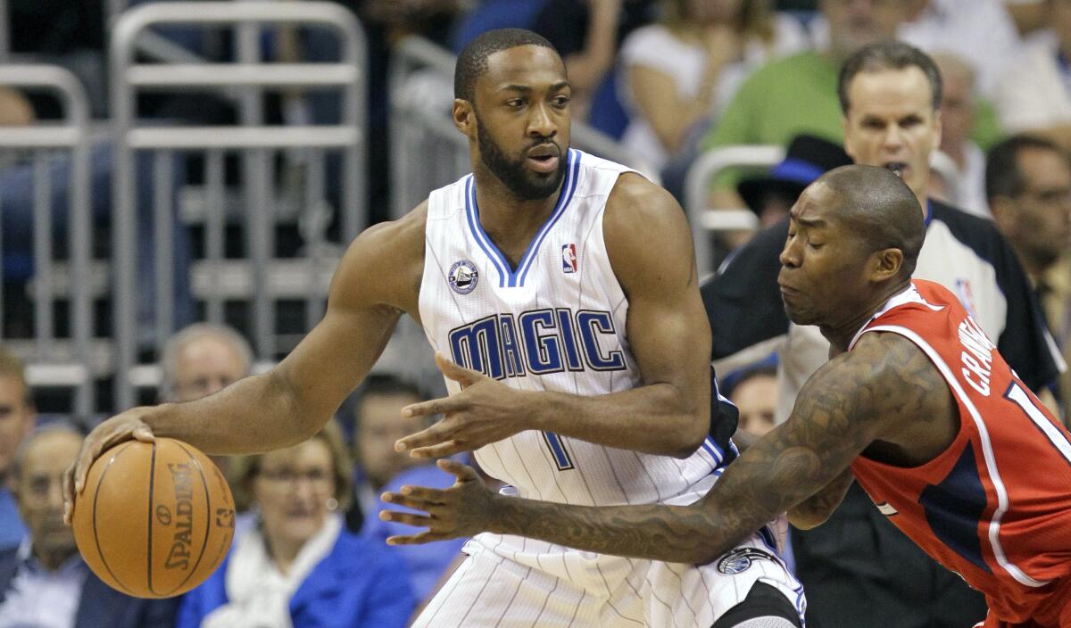 Orlando's Gilbert Arenas, left, looks for a way around Atlanta's Jamal Crawford during a 2011 game.