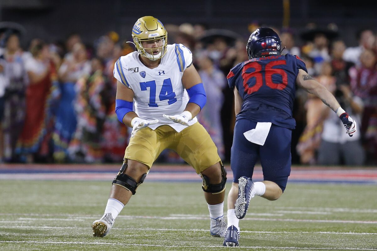 UCLA offensive lineman Sean Rhyan tries to stay in front of an Arizona linebacker during a game Sept. 28.
