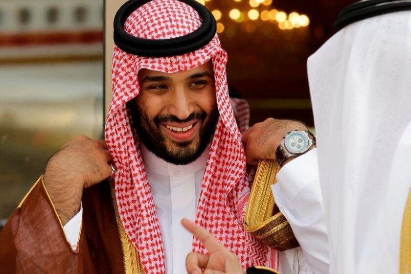 FILE - In this May 14, 2012 file photo, Prince Mohammed bin Salman speaks with a Saudi prince in Riyadh, Saudi Arabia. The disappearance of Saudi journalist and contributor to The Washington Post Jamal Khashoggi on Oct. 2, 2018, in Turkey peels away a carefully cultivated reformist veneer promoted about the Saudi Crown Prince, instead exposing its autocratic tendencies. The kingdom long has been known to grab rambunctious princes or opponents abroad and spirit them back to Riyadh on private planes. But the disappearance of Khashoggi, who Turkish officials fear has been killed, potentially has taken the practice to a new, macabre level by grabbing a writer who could both navigate Saudi Arabia’s byzantine royal court and explain it to the West. (AP Photo/Hassan Ammar, File)