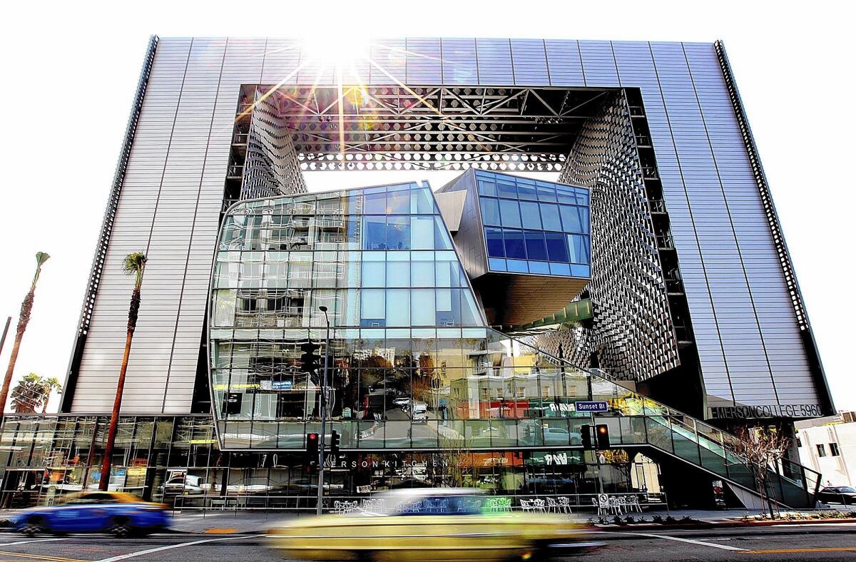 The new Emerson College campus in Hollywood features a giant silver frame-like facade that connects two residential towers to a sculptural base of lecture halls, theaters and production spaces.