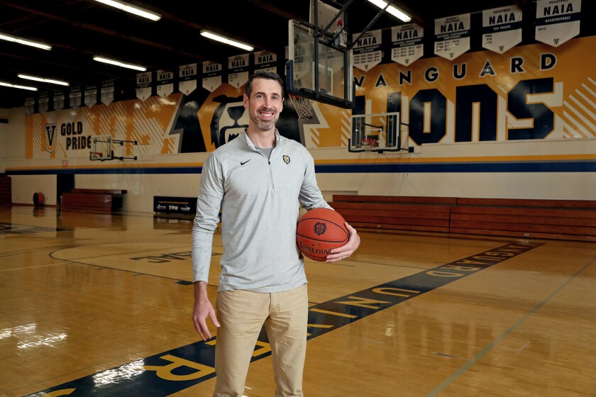 Rhett Soliday, associate athletic director and men's basketball coach, poses for a portrait at Vanguard University.