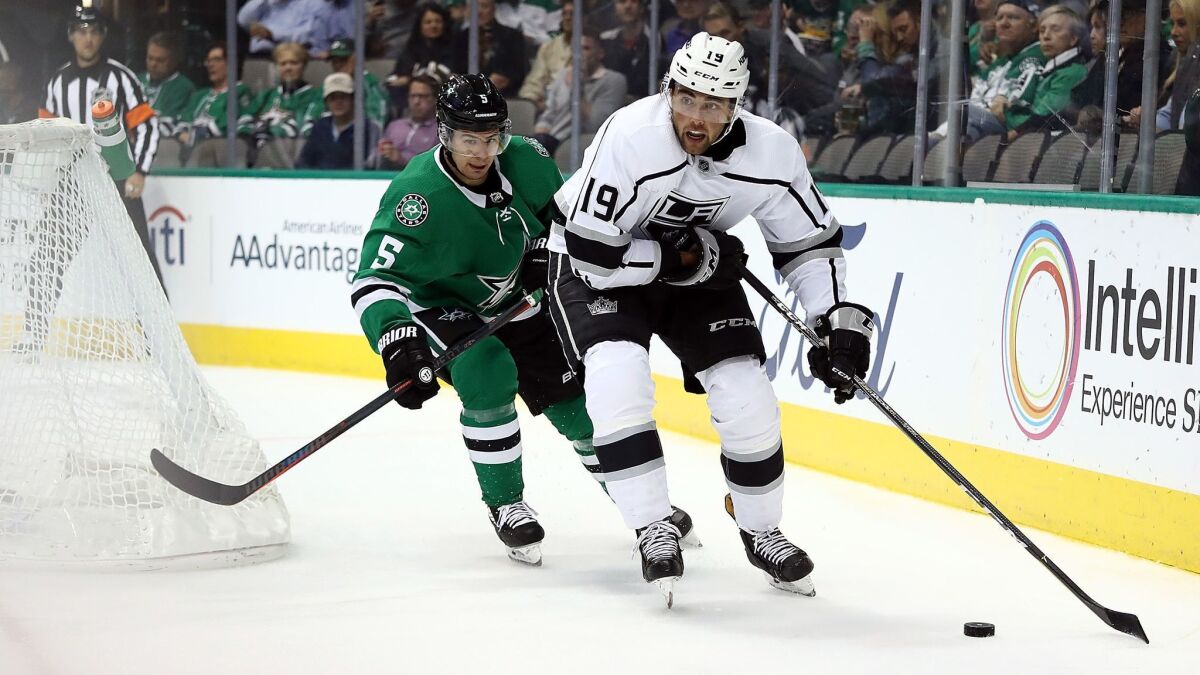 Kings' Alex Iafallo (19) skates the puck against Dallas Stars' Connor Carrick (5) in the second period at American Airlines Center on Tuesday in Dallas.