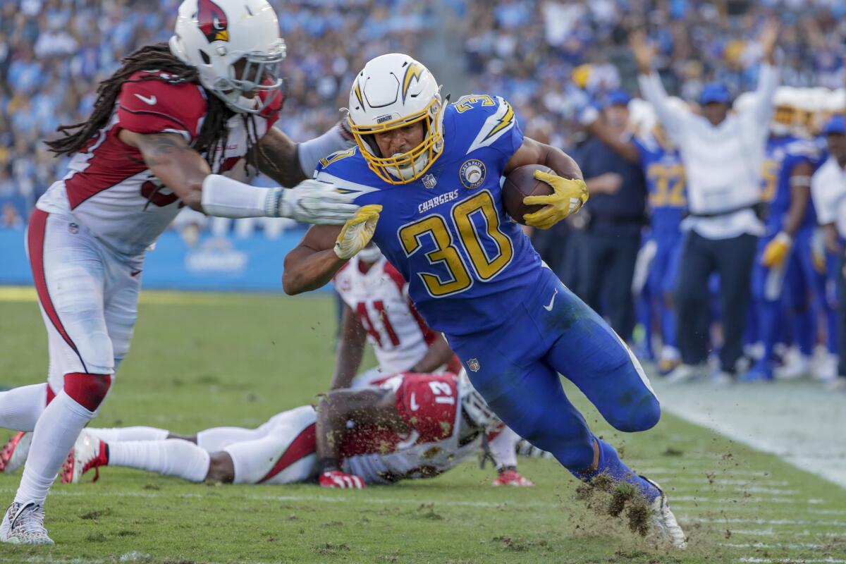 Chargers running back Austin Ekeler finishes a 13-yard run to the two-yard line during third-quarter action against the Arizona Cardinals at StubHub Center.